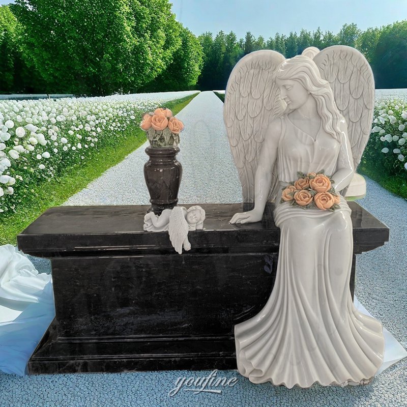 marble angel on tombstone with cherub