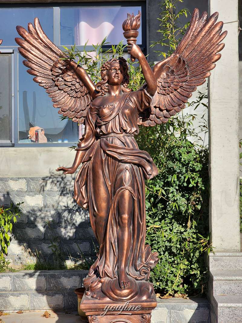 angel with torch statue