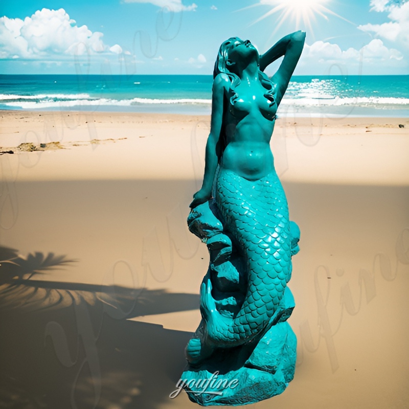 sitting mermaid sculpture