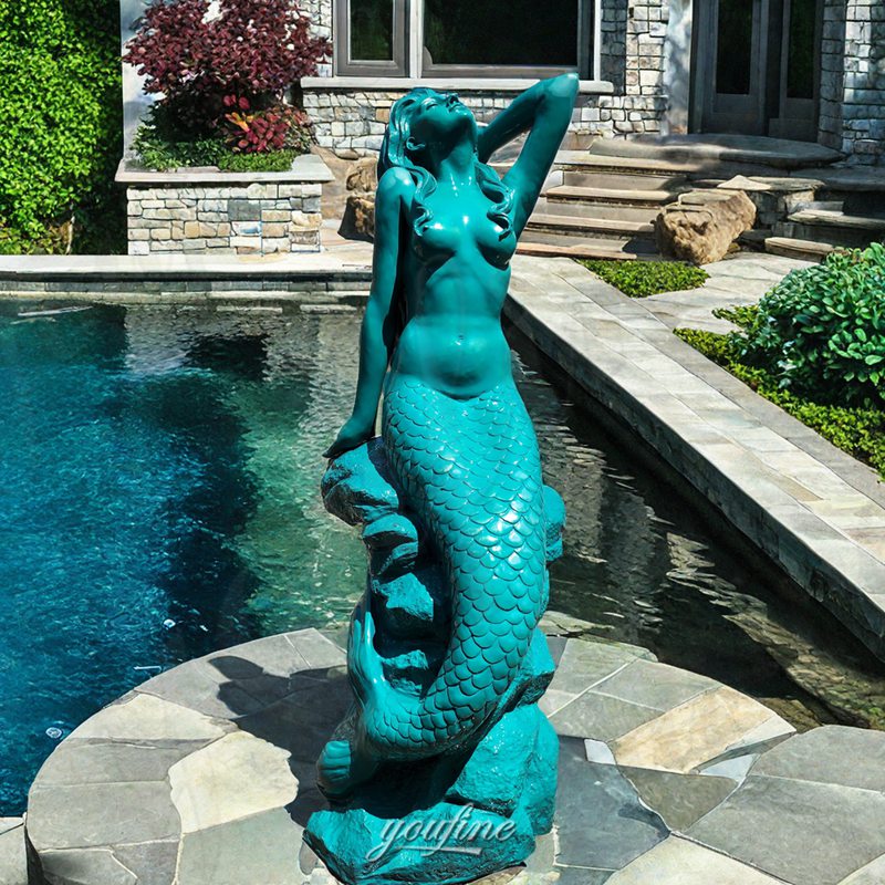 sitting mermaid statue