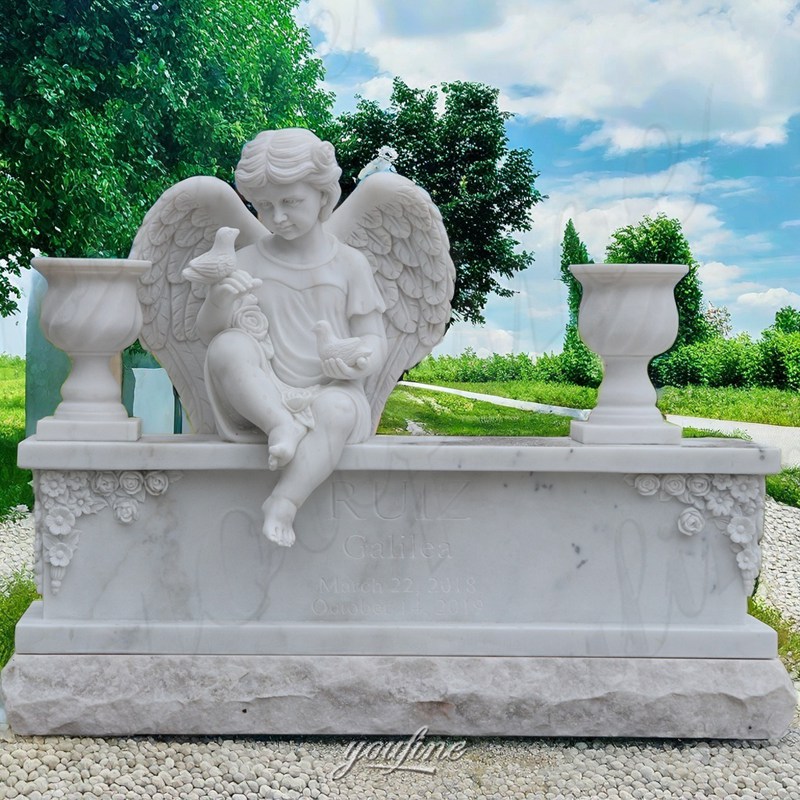 white marble cherub headstone