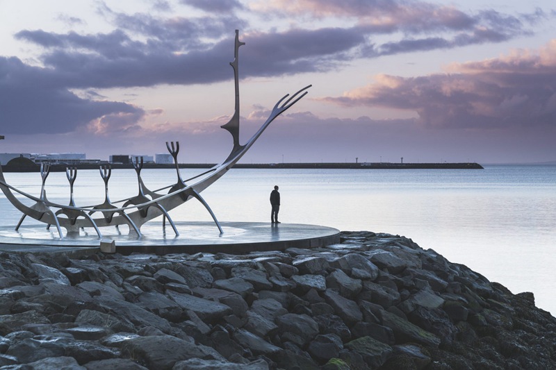 Stainless steel bone ship sculpture by the sea