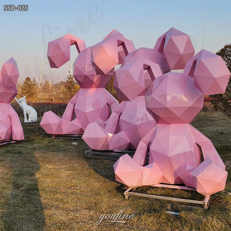 pink metal geometric rabbit statue