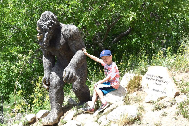 bigfoot statue and child