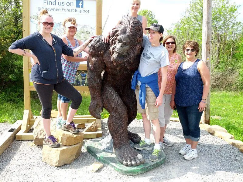 bigfoot statue and visitors