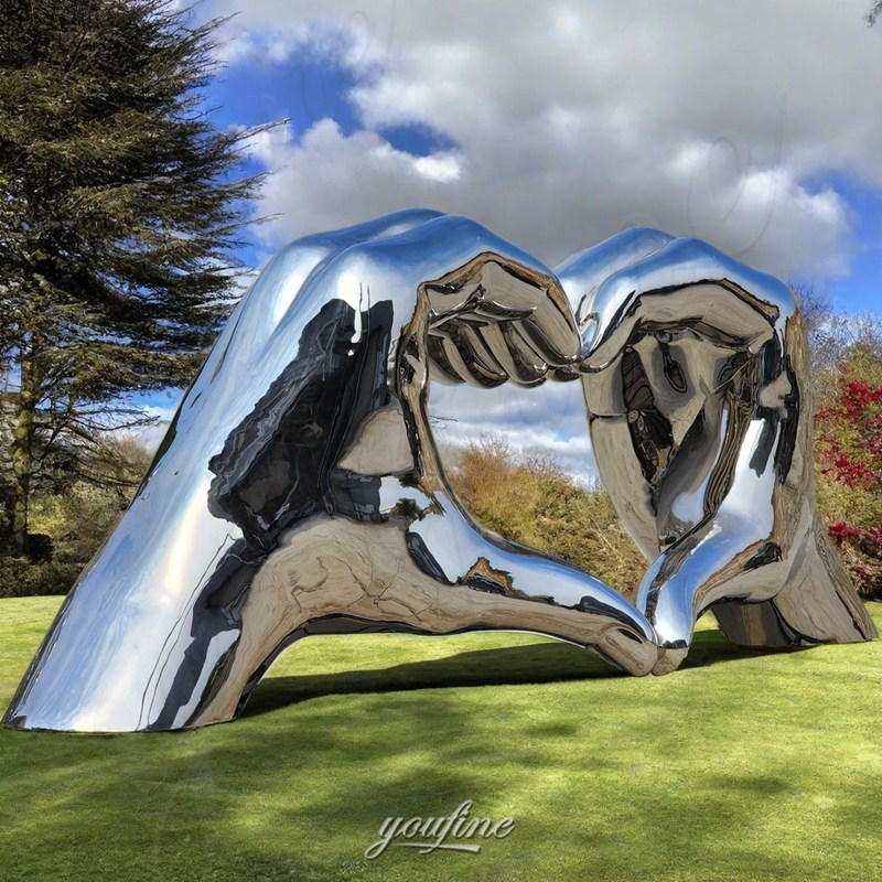 large mirror hand sculpture