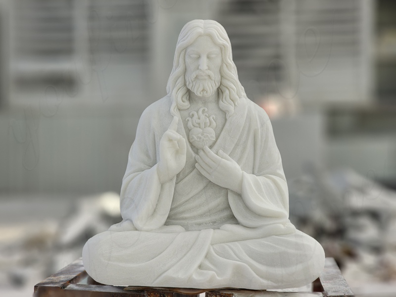 white marble meditating Jesus statue