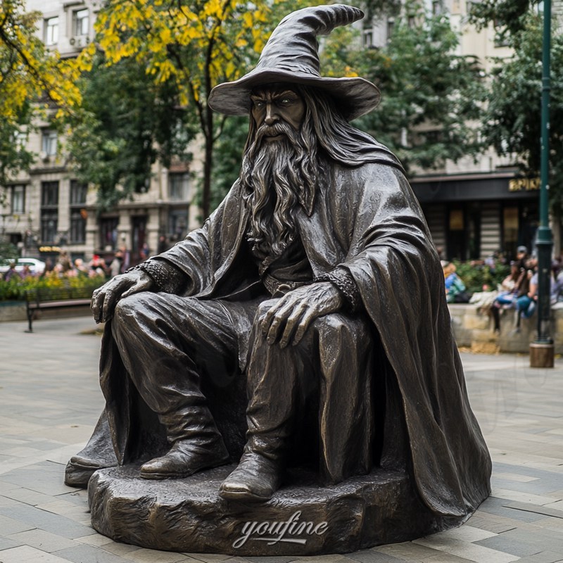 bronze gandalf sitting statue