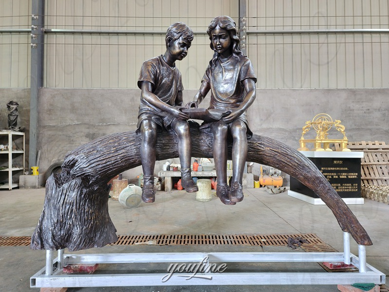 bronze boy and girl sculpture