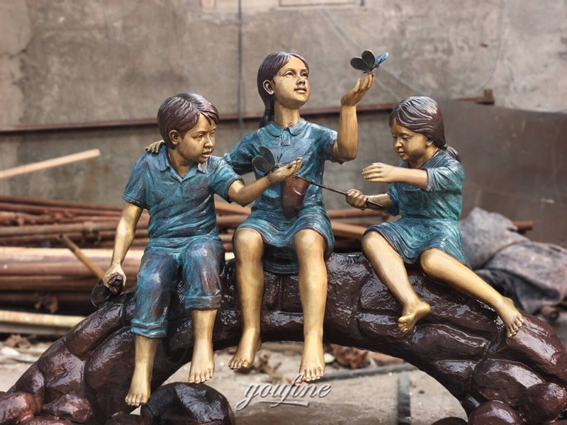 bronze boy and girl sculptures