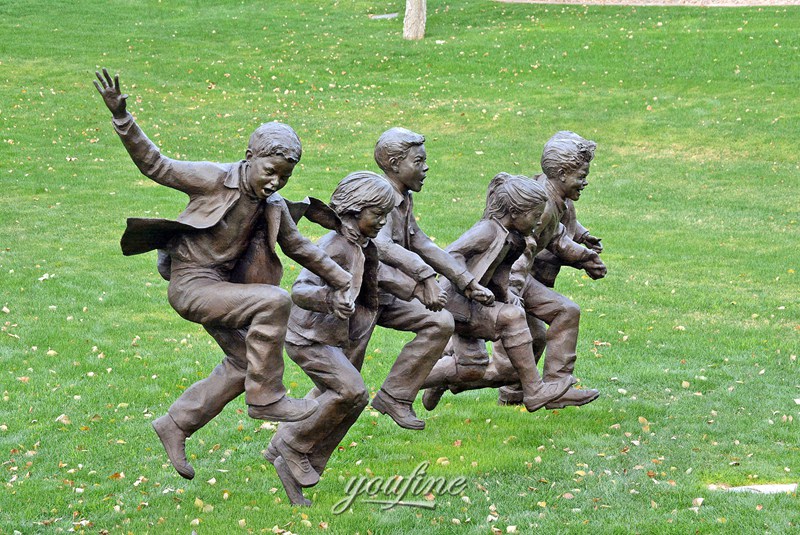 bronze boy and girl statue