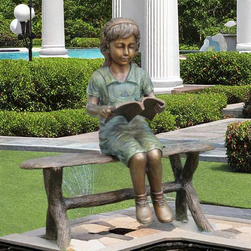 garden sculpture girl reading book