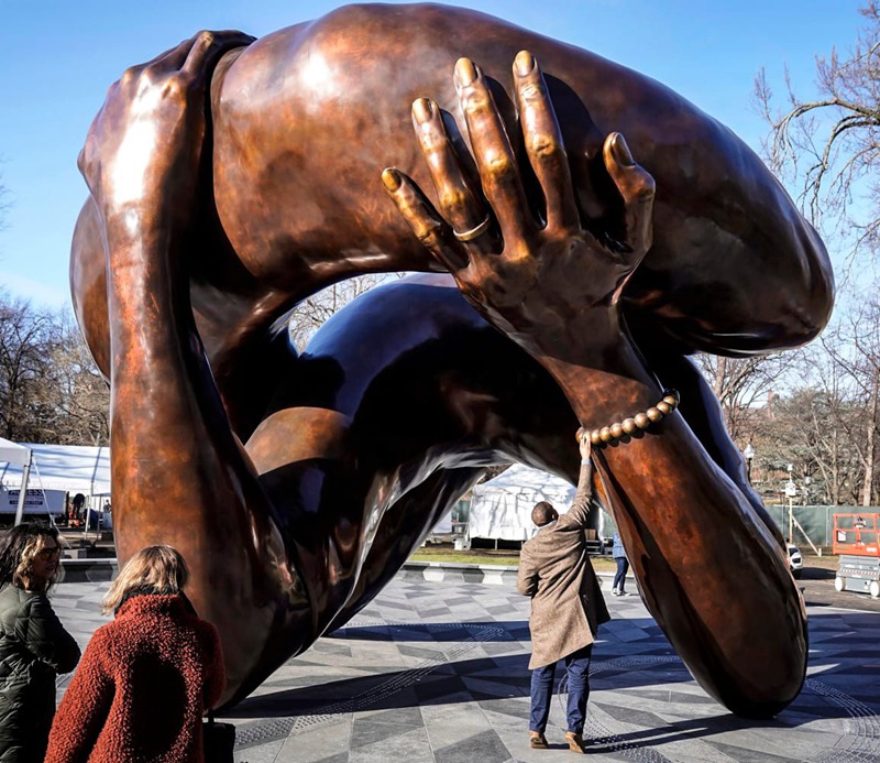 bronze sculpture of the embrace