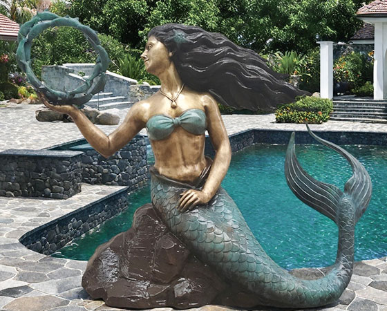 poolside mermaid statue